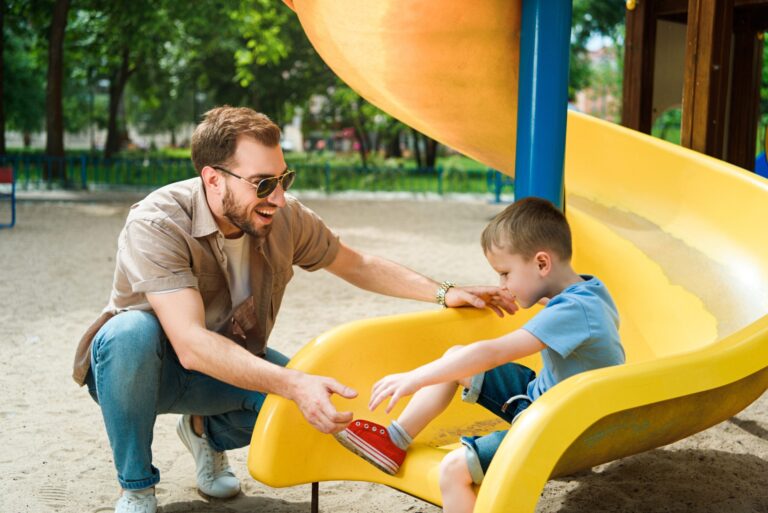 happy-father-and-son-having-fun-at-playground-in-p-2023-11-27-04-48-02-utc-1-scaled